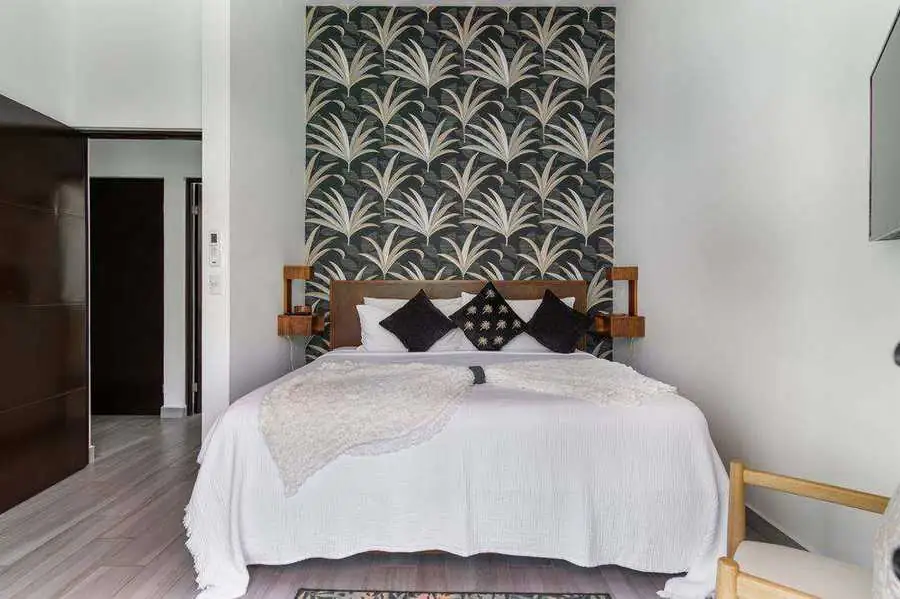 Bedroom interior with designer wallpaper accent wall