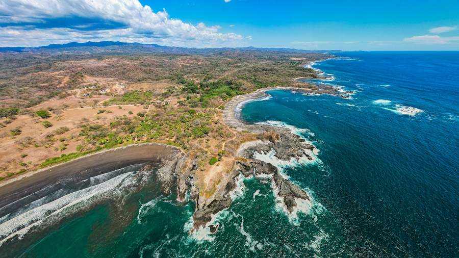 Aerial view of Playa Hermosa's crescent bay